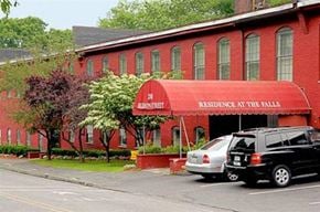 Northborough apartment for rent - a red building with cars parked in front of it