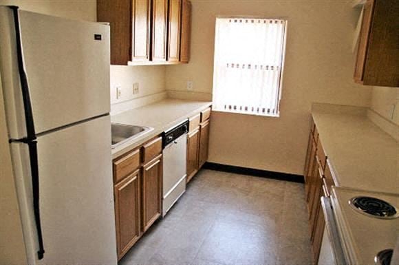 Northborough apartment for rent - a kitchen with a white refrigerator and a sink