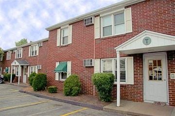Westfield apartment for rent - a red brick apartment building with a white door