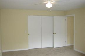 Worcester apartment for rent - an empty living room with a ceiling fan and a closet