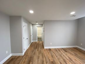 Worcester apartment for rent - Living room and hallway with laminate floors