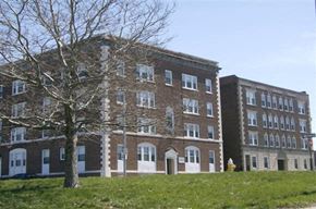 Worcester apartment for rent - a large brick building with a tree in front of it
