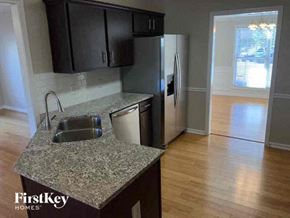 Stone Mountain house for rent - a kitchen with a sink and a refrigerator