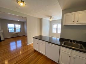 Worcester apartment for rent - Kitchen with white cabinets and white appliances
