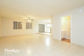 Browns Summit house for rent - A spacious room with a tiled floor and a ceiling fan.