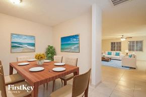Browns Summit house for rent - A dining room with a wooden table set for six.