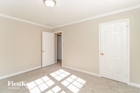 Clemmons house for rent - a bedroom with two white doors and a carpeted floor