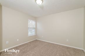 Jacksonville house for rent - a spacious room with carpet and a window