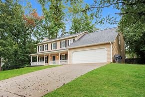 Sugar Hill house for rent - a house with a driveway and a white garage door