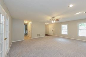 Sugar Hill house for rent - an empty living room with a ceiling fan