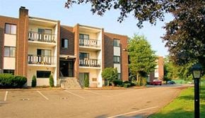 Braintree apartment for rent - an empty parking lot in front of an apartment building
