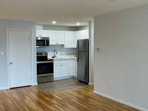Quincy apartment for rent - Renovated Kitchen with white cabinets, granite counters, stainless appliances and laminate floors