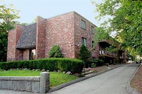 Quincy apartment for rent - a brick house on the side of a street