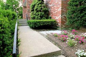 Quincy apartment for rent - a sidewalk in front of a brick building