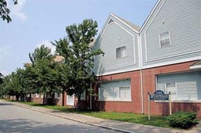 Attleboro apartment for rent - a building with a street sign in front of it
