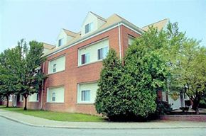 Attleboro apartment for rent - a brick building with trees in front of it