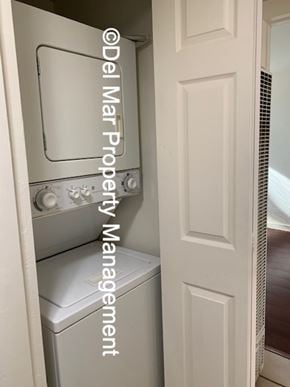 Grover Beach apartment for rent - A white door with a washing machine and dryer in it.