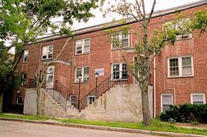 Worcester apartment for rent - a red brick building with a tree in front of it