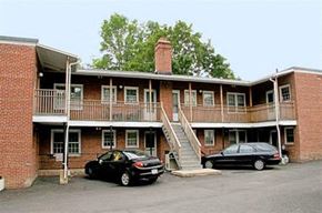 Worcester apartment for rent - two cars parked in front of a building