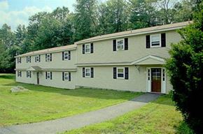 Charlton apartment for rent - a large white house with a sidewalk and trees