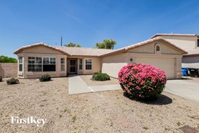 Phoenix house for rent - a house with pink flowers in front of it
