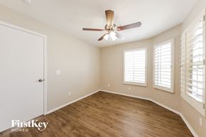 Phoenix house for rent - a living room with a ceiling fan and a window