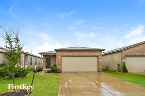 Houston house for rent - A house with a garage door is for sale by FirstKey Homes.