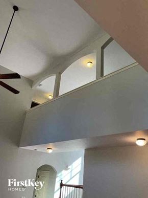 Kennesaw house for rent - a living room with a white ceiling and a ceiling fan