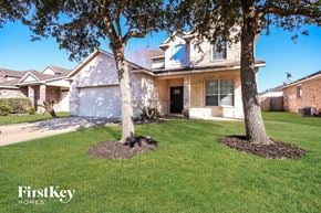 Baytown house for rent - a home with two trees in the front yard