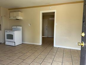 Killeen apartment for rent - an empty kitchen with a stove and a refrigerator