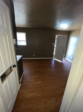 Killeen apartment for rent - a empty room with a wooden floor and a door