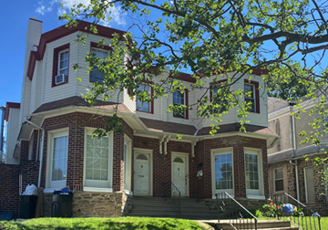 Philadelphia apartment for rent - a house with a tree in front of it