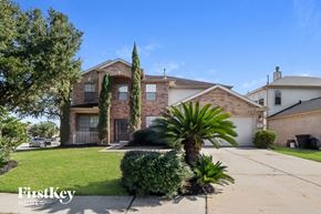 Humble house for rent - a house with a palm tree in the front yard