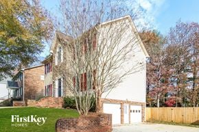 Winston Salem house for rent - A house with a tree in front of it.