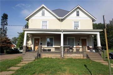 Canton apartment for rent - A two-story house with a front porch.