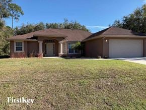North Port house for rent - a house with a lawn in front of it