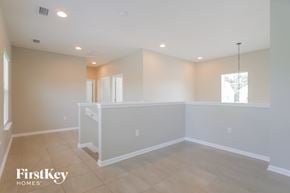 St Augustine house for rent - A spacious room with a white reception desk and a hanging light fixture.