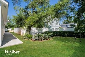 St Augustine house for rent - A well-maintained lawn and trees are visible in the image.