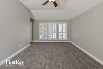 Cypress house for rent - a spacious living room with carpet and a ceiling fan