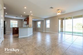 Ruskin house for rent - an open kitchen and living room with tile flooring