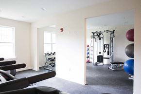 Garfield apartment for rent - a gym with treadmills and other exercise equipment in a home gym