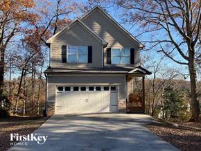 Buford house for rent - a house with a driveway and a garage door
