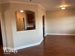 Buford house for rent - an empty living room with a large mirror in it