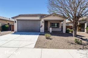 Queen Creek house for rent - a home with a tree and a driveway in front of it