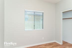 Queen Creek house for rent - a bedroom with a window and a door to a closet
