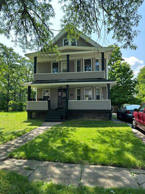 Cleveland apartment for rent - a house with a lawn and a sidewalk