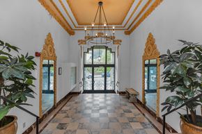 San Francisco apartment for rent - A hallway with a checkered floor and a ceiling light.