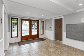 San Francisco apartment for rent - A hallway with a brown door and a sign that says "PAGE" on the wall.