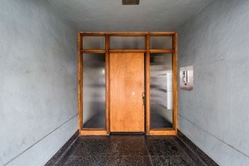 San Francisco apartment for rent - A wooden door with glass panels is closed.