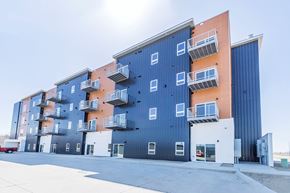 South Sioux City apartment for rent - the exterior of an apartment building with blue and orange facade